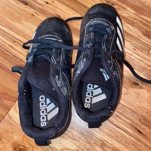 Little boy baseball cleats